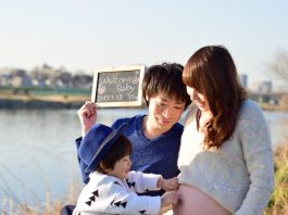 young family taking photo